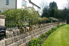 simple-railing-atop-a-stone-wall